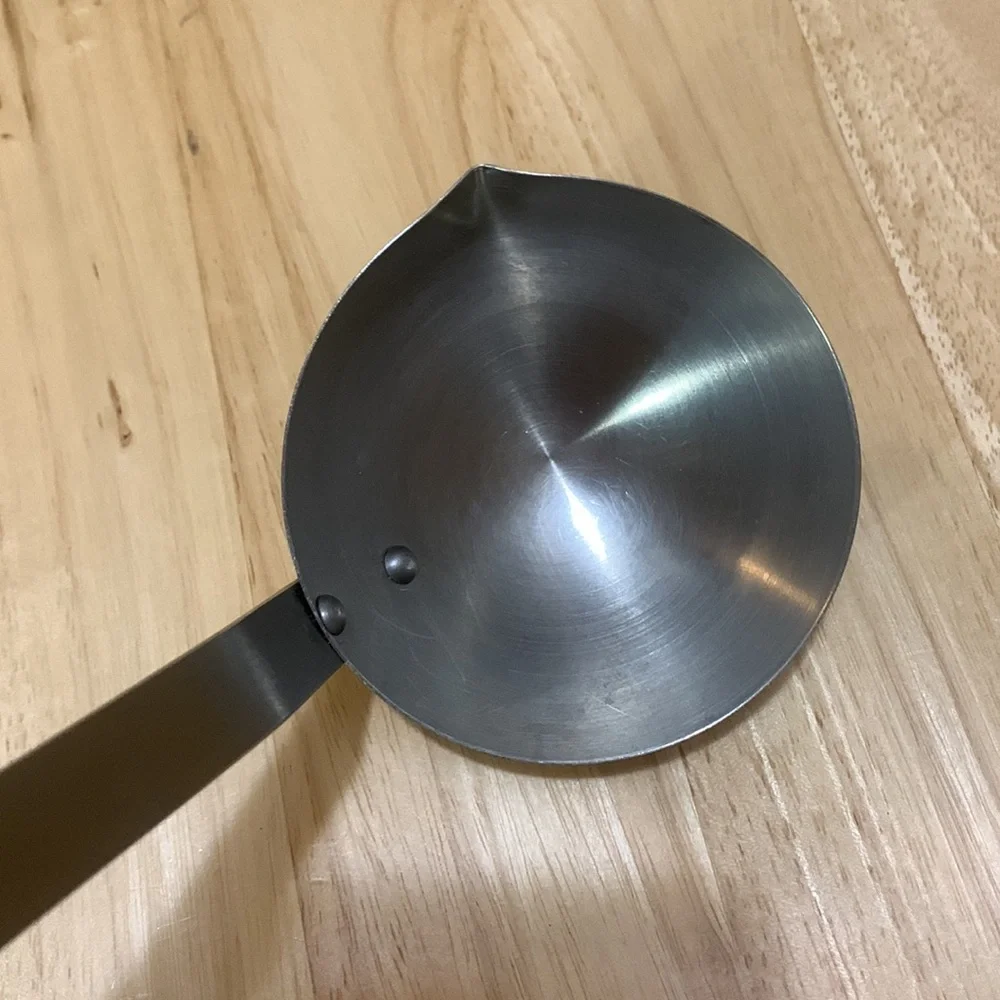 Stainless Steel vintage Ladle with cool sculpted handle